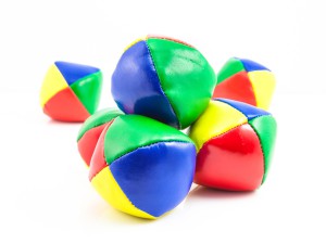 Concept for Multitasking Challenges, Group of Colorful Juggling Balls on White Background